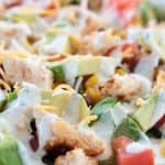 Southwest Ranch Salad with Chicken - green leaf lettuce, red onion, black beans, corn, cheese, tomato and avocado with a greek yogurt Ranch lime dressing.