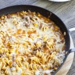 Cheesy Beef Taco Noodles - ground beef, onion, cheese soup, salsa, corn and Light 'n Fluffy Noodles. Easy to make and on the table in about 25 minutes!