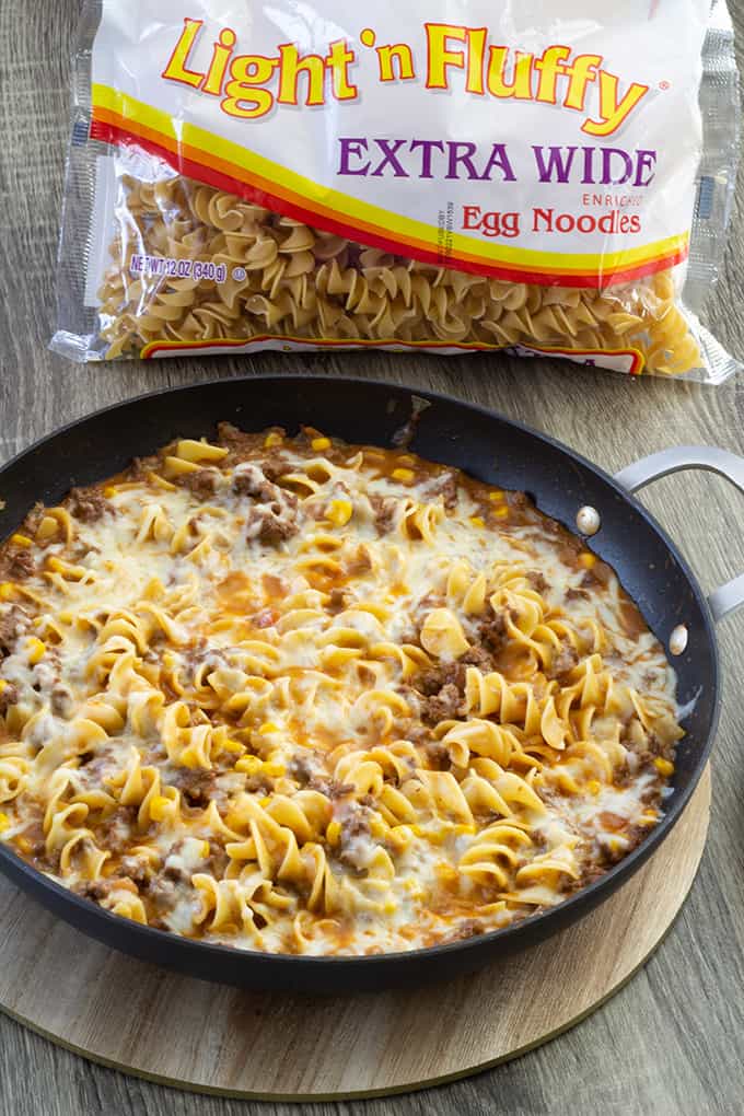 Cheesy Beef Taco Noodles - ground beef, onion, cheese soup, salsa, corn and Light 'n Fluffy Noodles. Easy to make and on the table in about 25 minutes!