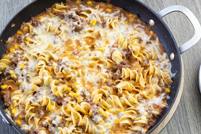 Cheesy Beef Taco Noodles - ground beef, onion, cheese soup, salsa, corn and Light 'n Fluffy Noodles. Easy to make and on the table in about 25 minutes!