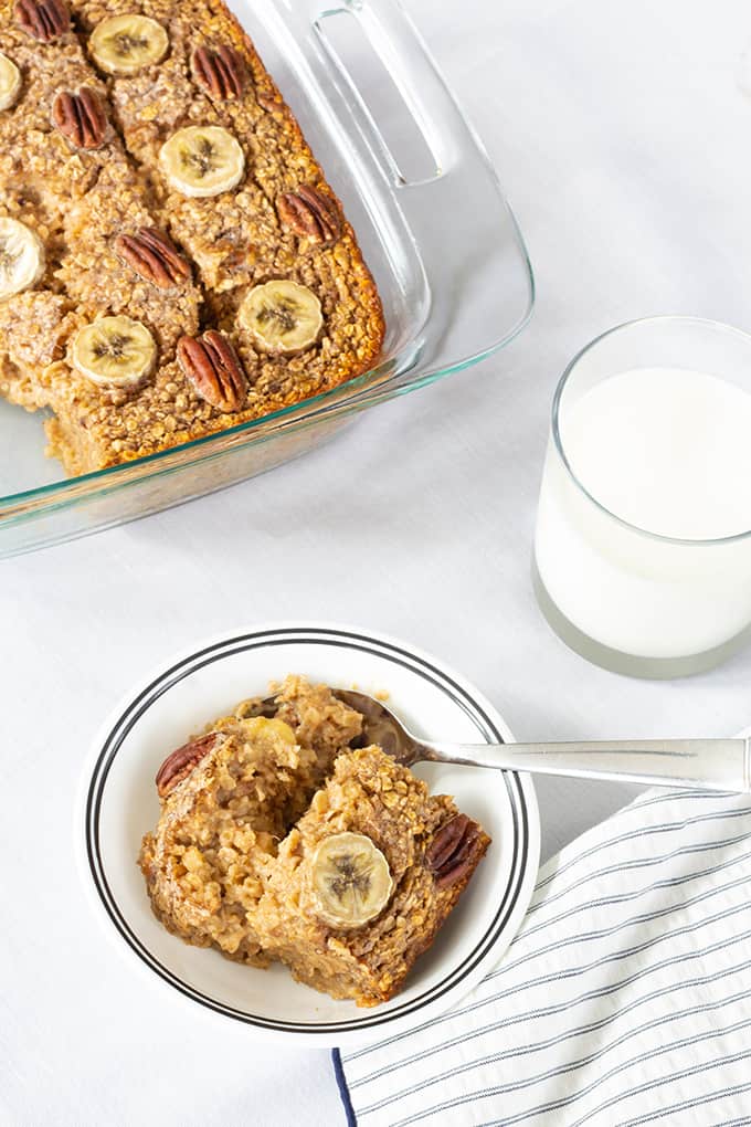 Chocolate Banana Nut Baked Oatmeal is a creamy version of the popular breakfast cereal featuring chocolate milk, bananas, nuts, and other pantry staples. 