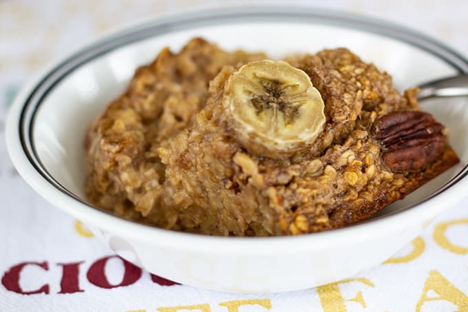 Chocolate Banana Nut Baked Oatmeal is a creamy version of the popular breakfast cereal featuring chocolate milk, bananas, nuts, and other pantry staples.