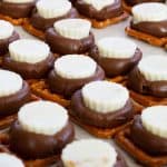 Chocolate Peanut Butter Pretzels feature Hershey's Kisses, Mini White Chocolate Peanut Butter Cups and miniature pretzels. They make a great party snack!