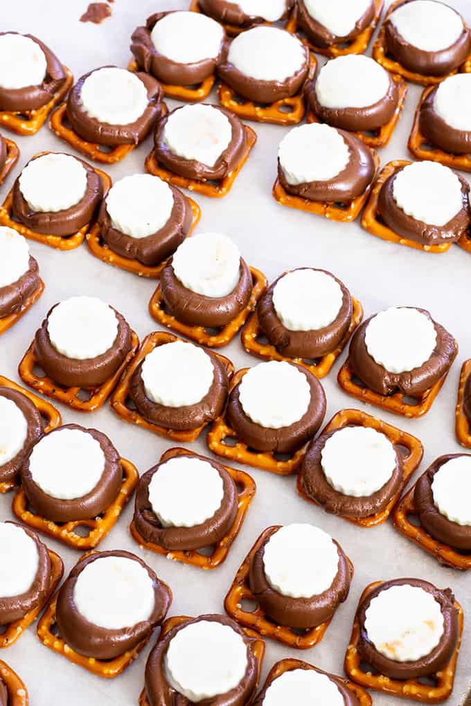 Chocolate Peanut Butter Pretzels feature Hershey's Kisses, Mini White Chocolate Peanut Butter Cups and miniature pretzels. They make a great party snack!