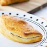 Sausage & Apple Hand Pies are made with ground sausage, apples, celery, and canned biscuits for a tasty mini hand held snack that is so easy to make!