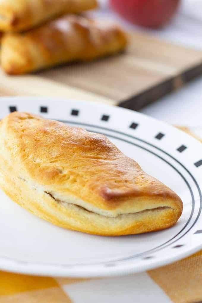 Sausage & Apple Hand Pies are made with ground sausage, apples, celery, and canned biscuits for a tasty mini hand held snack that is so easy to make! 