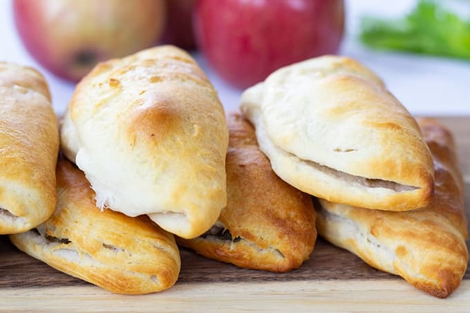 Sausage & Apple Hand Pies are made with ground sausage, apples, celery, and canned biscuits for a tasty mini hand held snack that is so easy to make! 