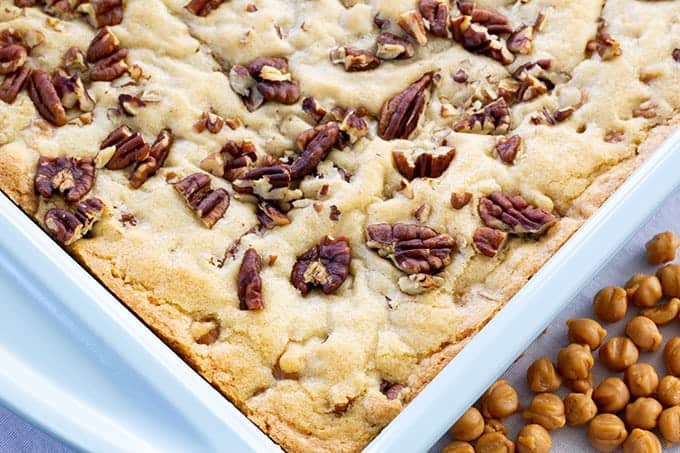 Easy Caramel Pecan Blondies - Made with common pantry ingredients, these easy to make bar cookies taste amazing and are full of caramel bits and pecans!