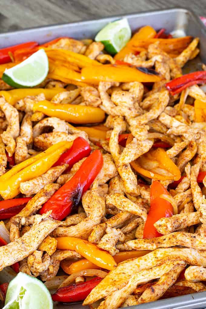 Sheet Pan Chicken Fajitas made with baby bell peppers, onion and chili powder cooked perfectly on a sheet pan, making an easy and quick Tex - Mex meal.