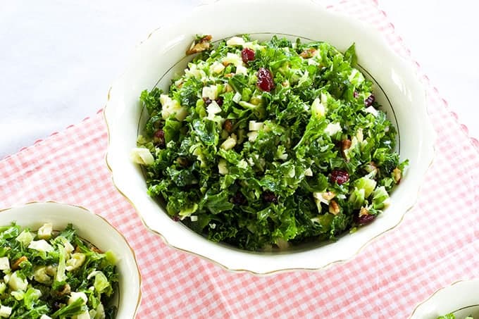 Brussels Sprouts & Kale Salad is a copycat of the Cracker Barrel recipe and features pecans, cranberries and is topped with a simple maple vinaigrette. 