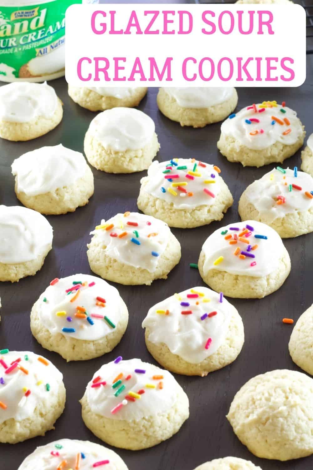 Glazed Sour Cream Cookies are soft and fluffy cake like cookies that are sure to become a favorite for holidays and parties all year around. via @mindyscookingobsession