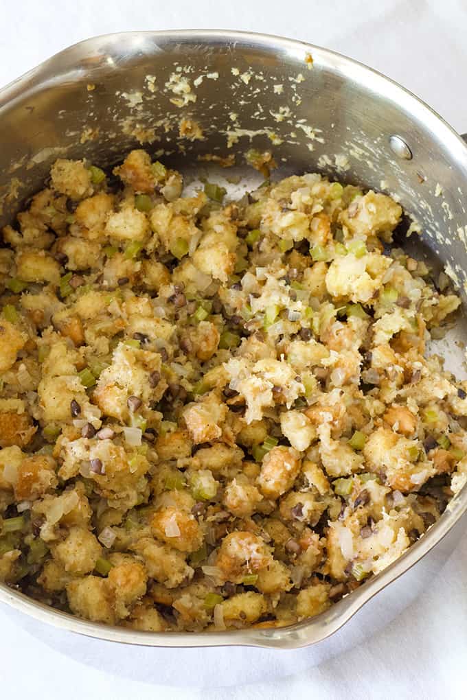 close up overhead view of a dutch oven with fresh homemade stove top stuffing in it. 