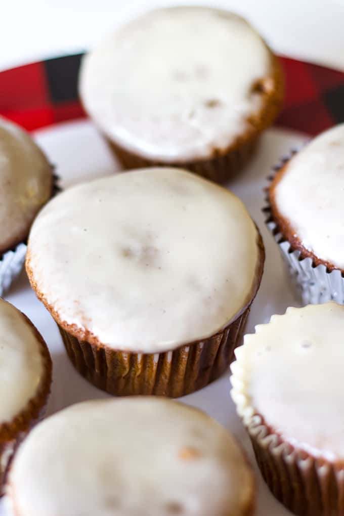 Gingerbread Cupcakes with Maple Glaze are moist and spicy, topped with an easy and flavorful glaze making them the perfect holiday dessert!
