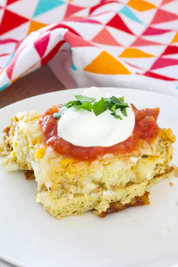 Tater Tot Breakfast Casserole - tater tots, eggs, milk and spices baked to perfection and topped with lots of cheese, sour cream and salsa.