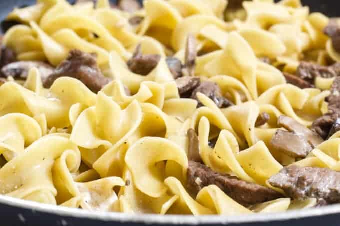 One Pan Beef Stroganoff features sirloin steak, egg noodles, beef broth and fresh mushrooms made in one skillet for quick and easy cleanup.