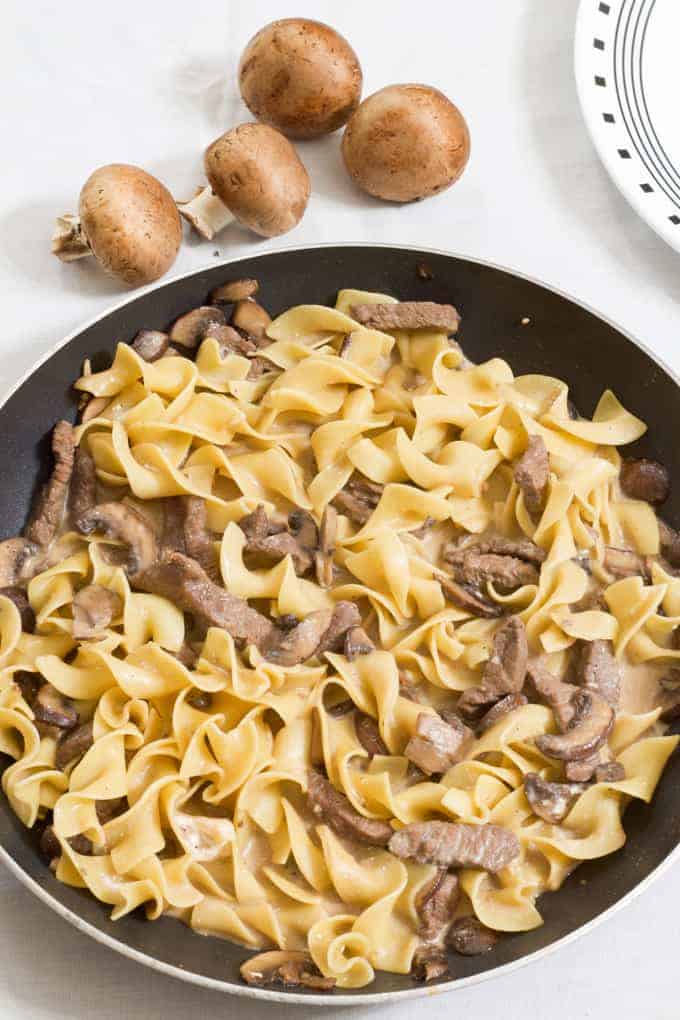 One Pan Beef Stroganoff features sirloin steak, egg noodles, beef broth and fresh mushrooms made in one skillet for quick and easy cleanup.