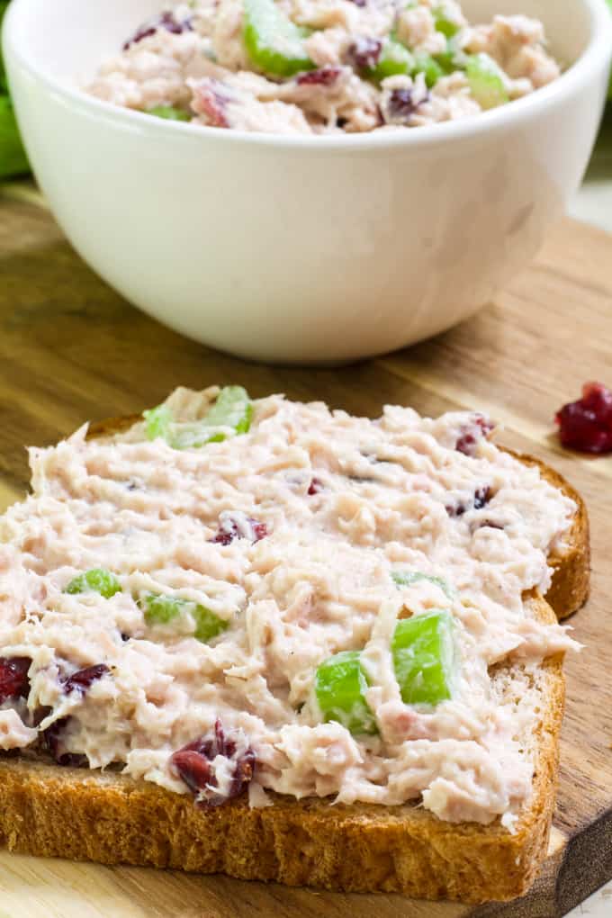 Healthy Cranberry Tuna Salad features canned tuna, mayo, Greek yogurt, celery, craisins, salt, pepper and a splash of lemon juice. So easy!