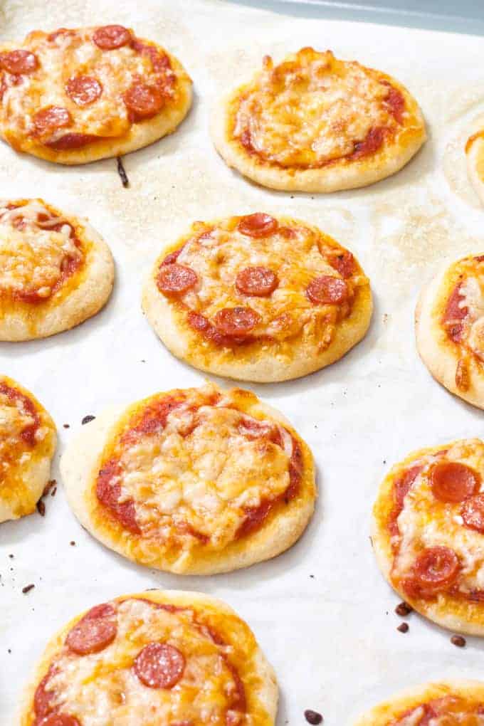 Mini Pepperoni Pizza Appetizers are super easy and require just 4 ingredients; store bought pizza crust, sauce, pepperoni and cheese.