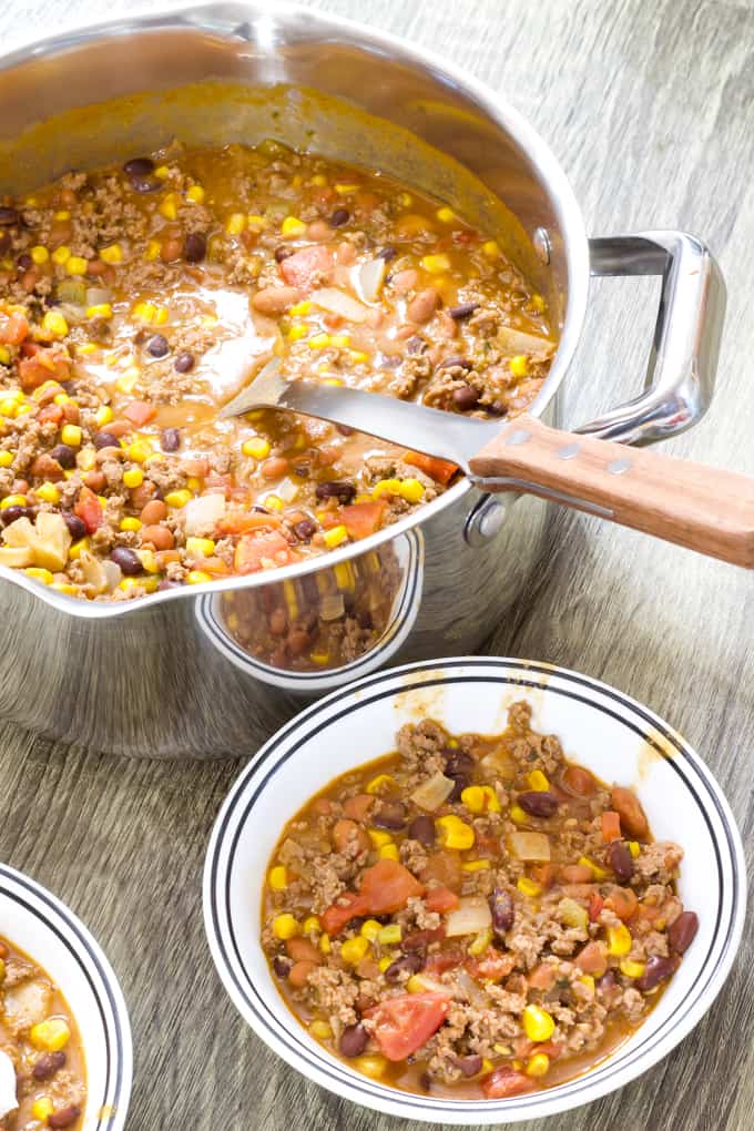 Mild Mexican Taco Chili features ground beef, tomatoes, two kinds of beans, corn, green chiles, taco seasoning and Ranch dressing. 