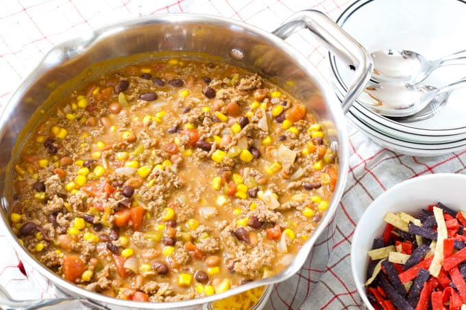 Mild Mexican Taco Chili features ground beef, tomatoes, two kinds of beans, corn, green chiles, taco seasoning and Ranch dressing. 