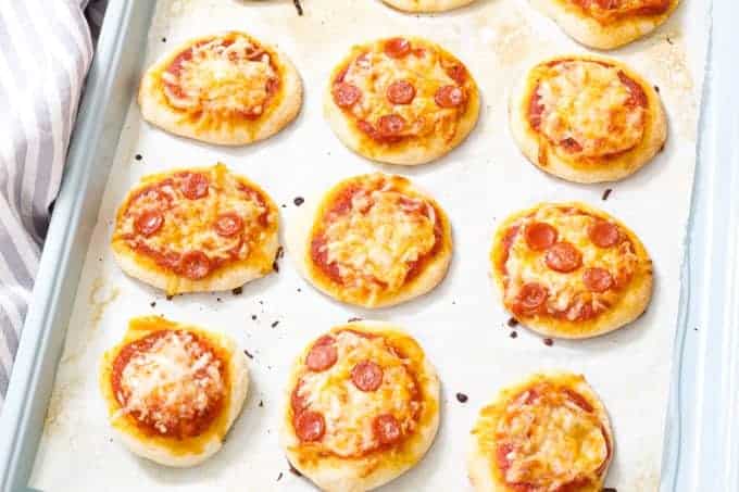 Mini Pepperoni Pizza Appetizers are super easy and require just 4 ingredients; store bought pizza crust, sauce, pepperoni and cheese.