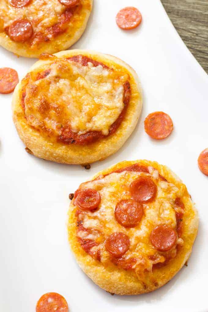 Mini Pepperoni Pizza Appetizers are super easy and require just 4 ingredients; store bought pizza crust, sauce, pepperoni and cheese.