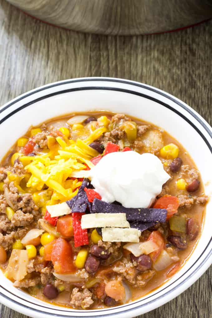 Mild Mexican Mexican Chili features ground beef, tomatoes, two kinds of beans, corn, green chiles, taco seasoning and Ranch dressing. 