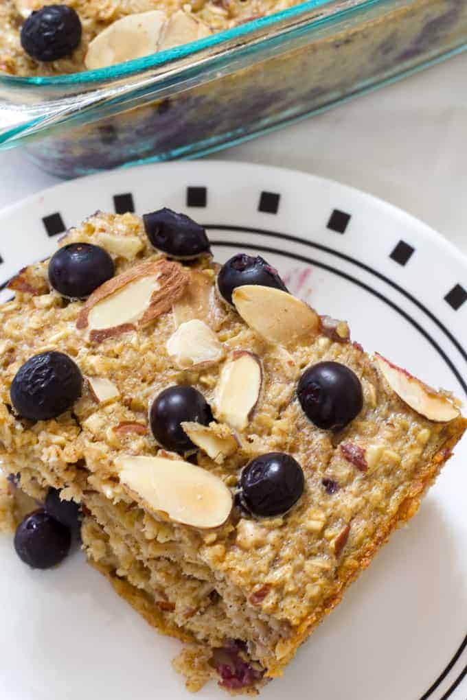 Blueberry Almond Baked Oatmeal is easy and full of healthful ingredients like oats, almonds, blueberries, unsweetened applesauce and eggs.