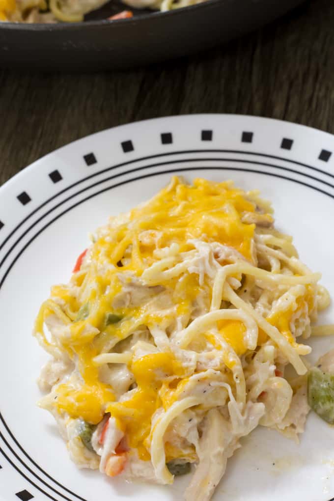 Skinny Baked Chicken Spaghetti - tender chicken and spaghetti in a cream cheese sauce is baked in the oven and topped with cheddar cheese.