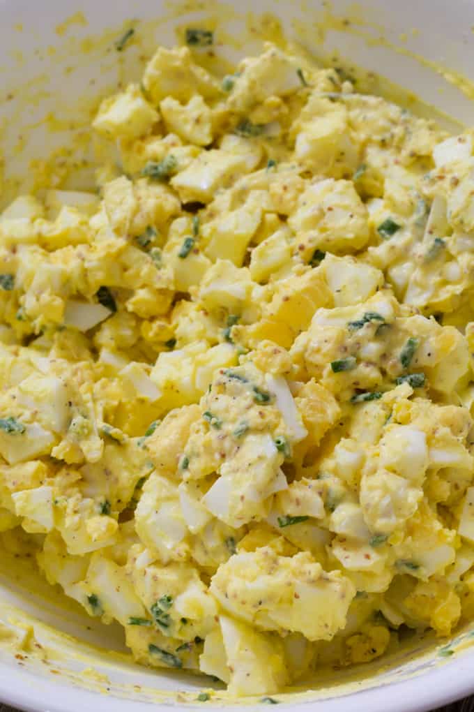 How to make a Classic Egg Salad sandwich with mayonnaise, grainy Dijon mustard, salt pepper and chives. An easy, simple and quick recipe.