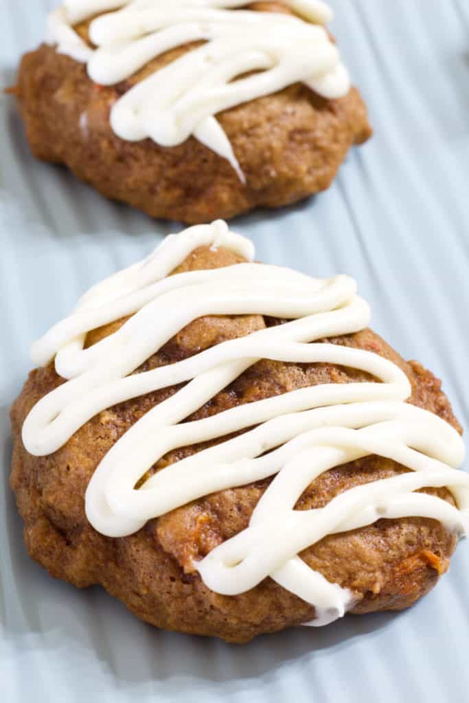 Very close up view of a carrot cake mix cookie ona light blue cookie sheet