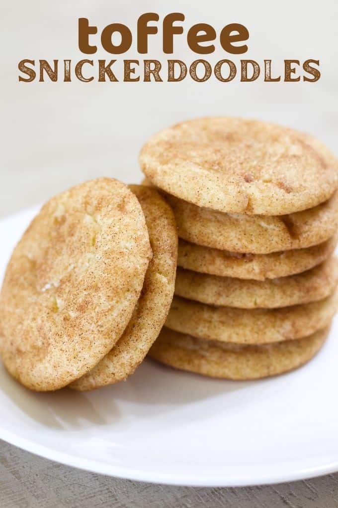 Close up view of a stack of 6 toffee snickerdoodle cookies and 2 leaning cookies leaning up against he stack.