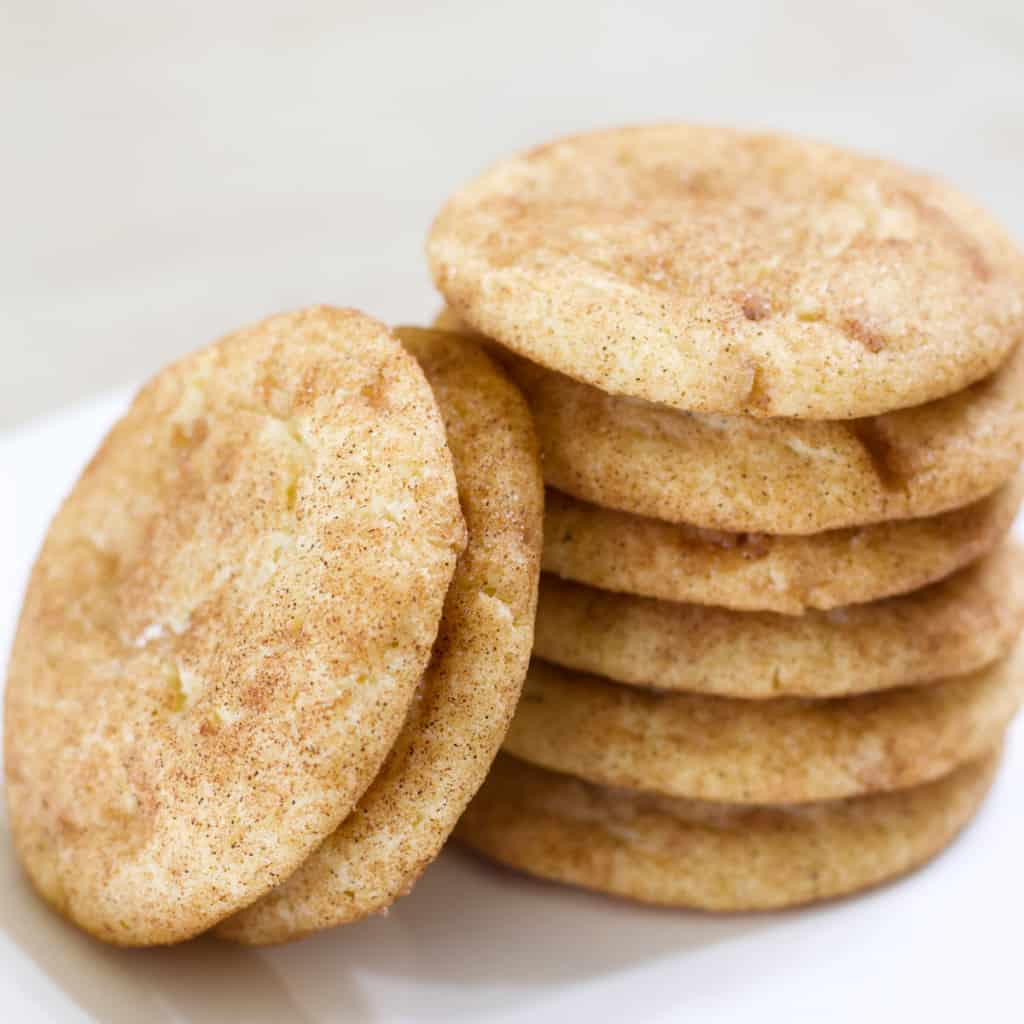 Close up side view shot of a stack of toffee snickerdodle cookies.