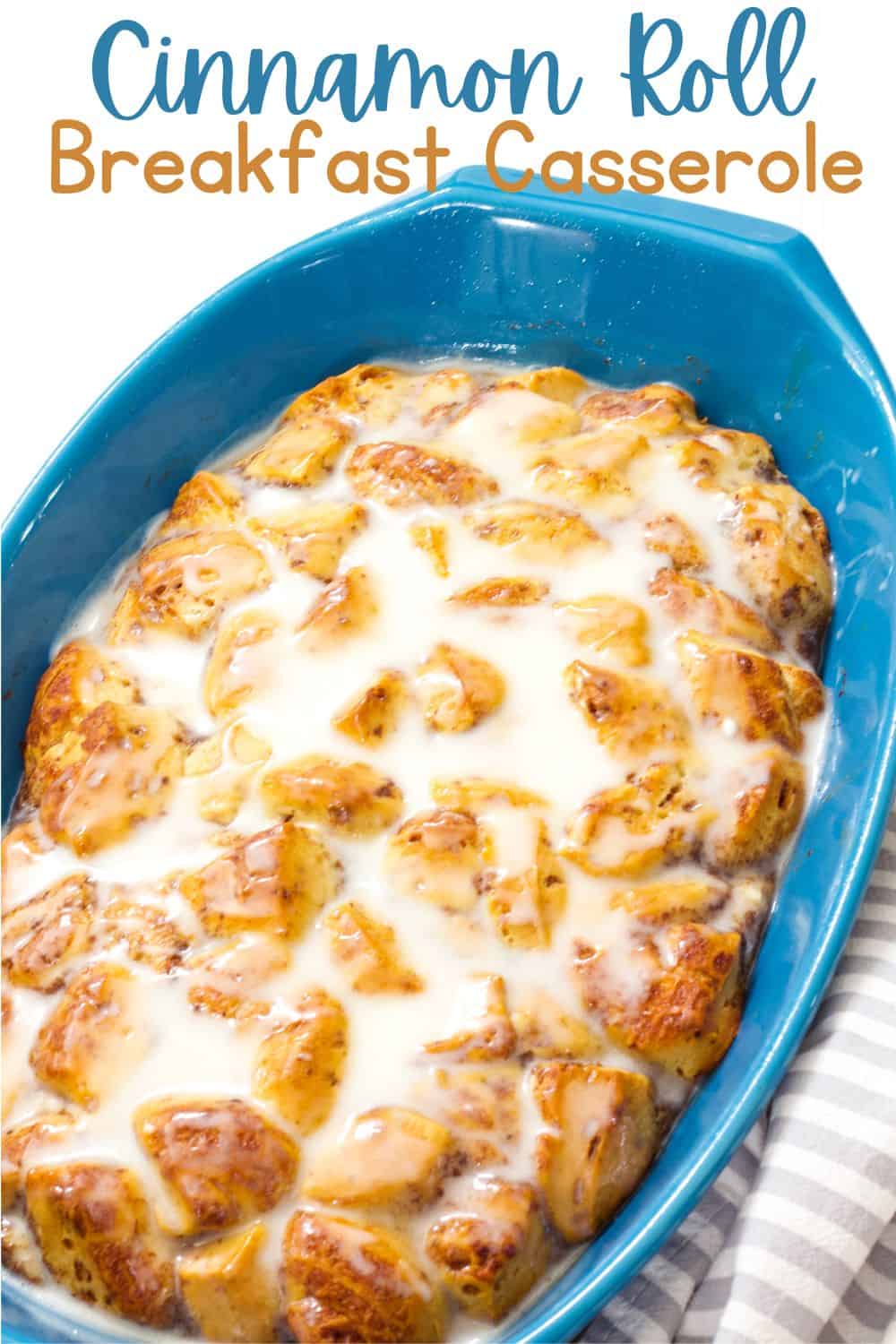 Very close up shot of the whole uncut cinnamon roll breakfast casserole in a blue baking dish.