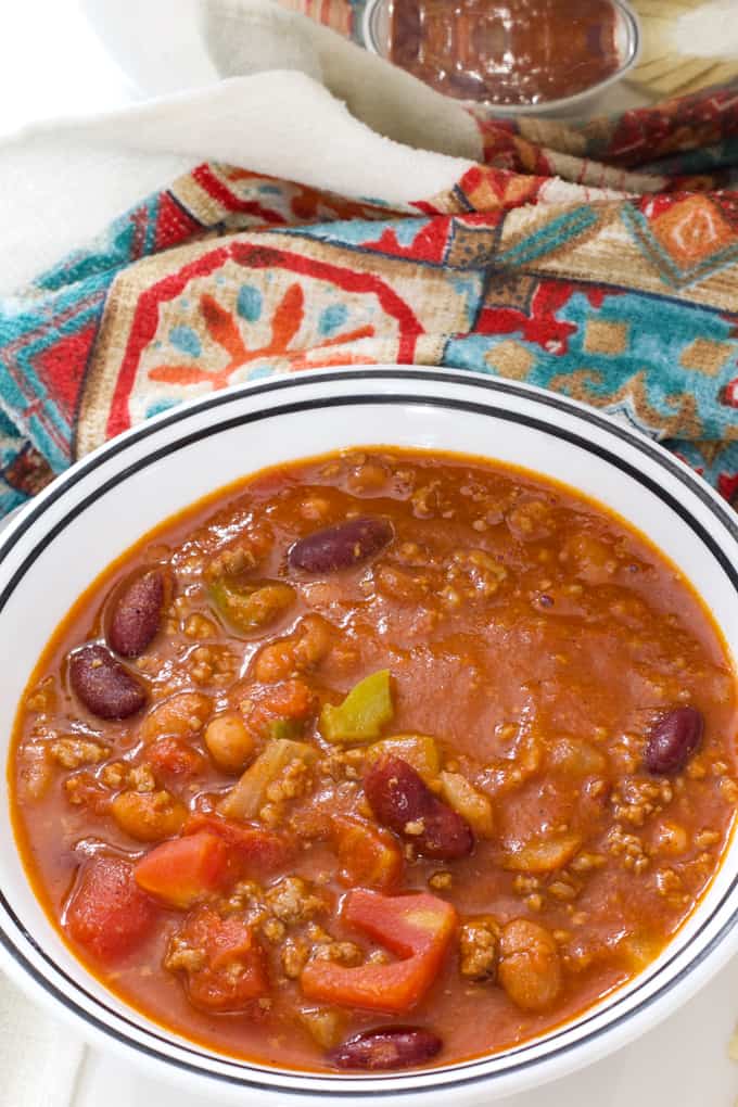 Close up overhead shot of one bowl of chili with beans.