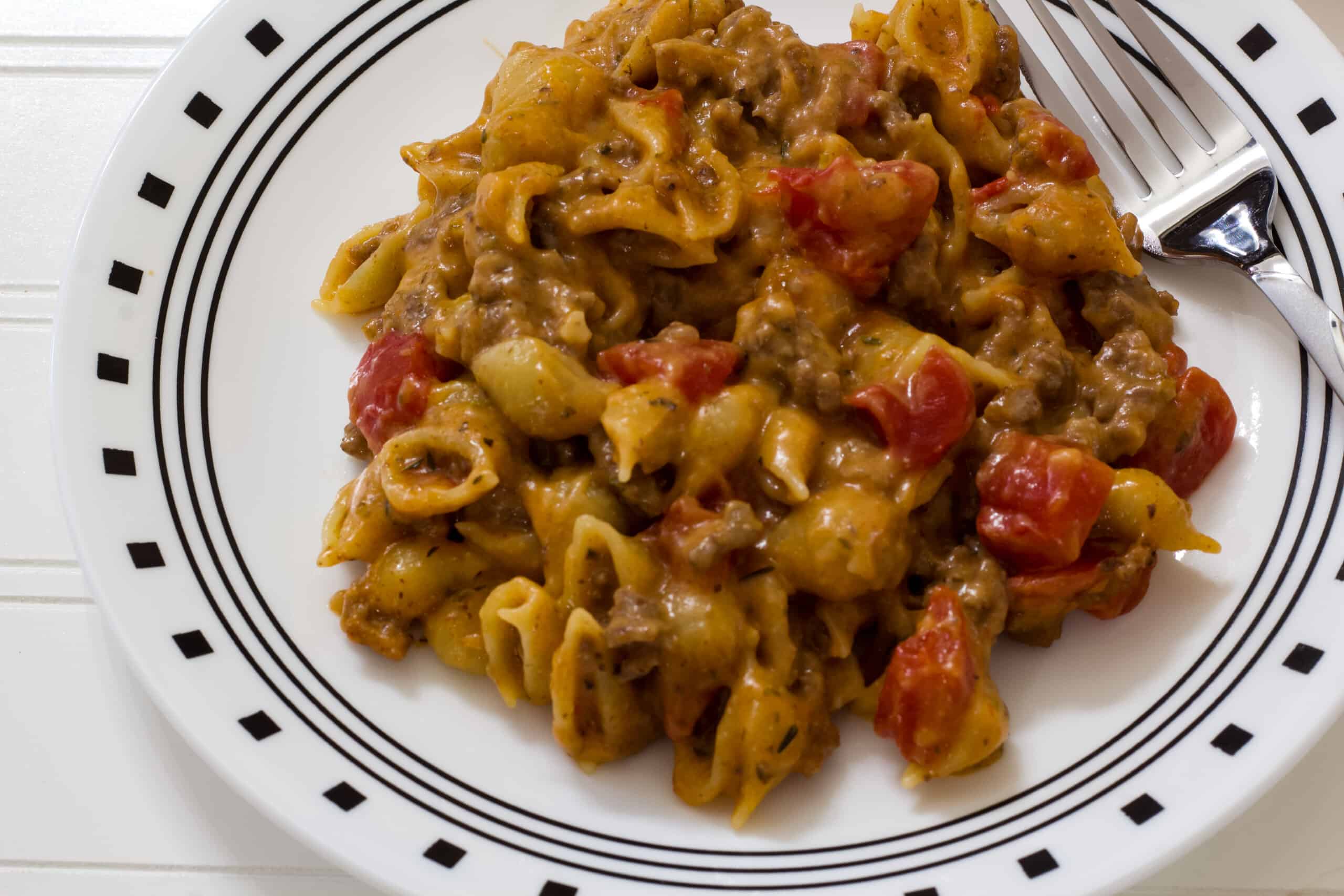 One serving of the finished pasta dish on a white plate.