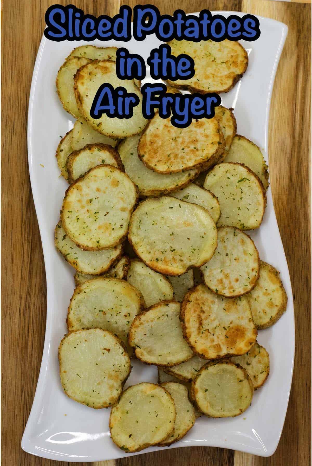 The finished sliced potatoes in the air fryer with the recipe title at the top of the image.