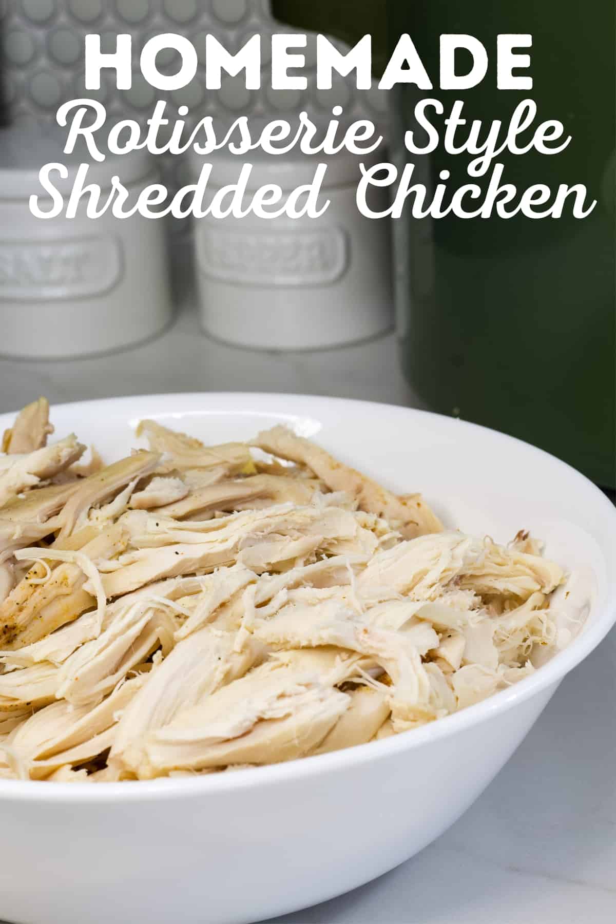A white bowl filled with shredded chicken with the recipe title at the top of the image.