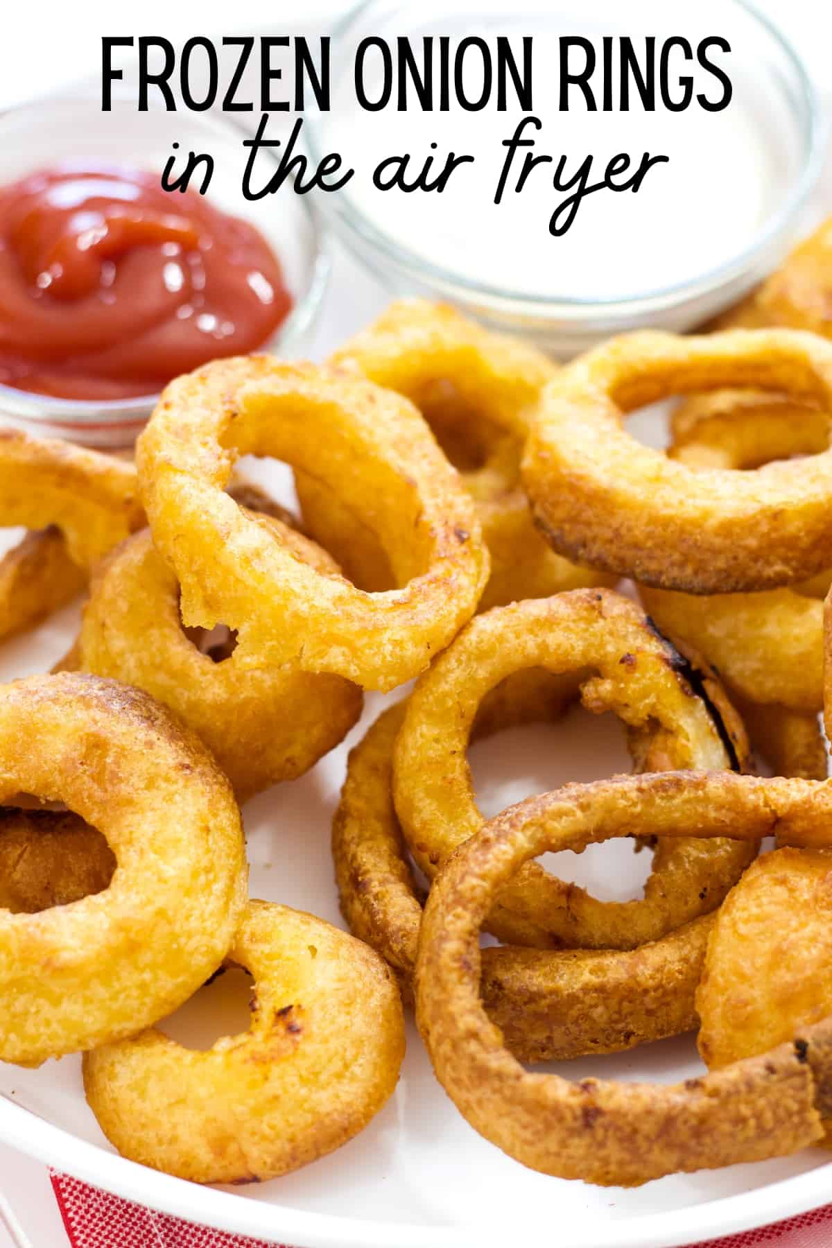 An image of the onion rings to share on Pinterest because it has the recipe title on the top center of the image.