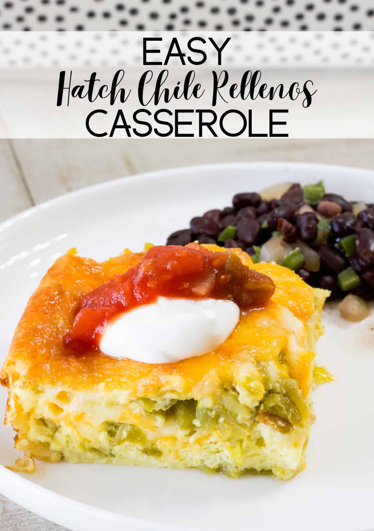 One piece of easy hatch chile rellenos casserole topped with sour cream and salsa. The recipe title is at the top of the image.