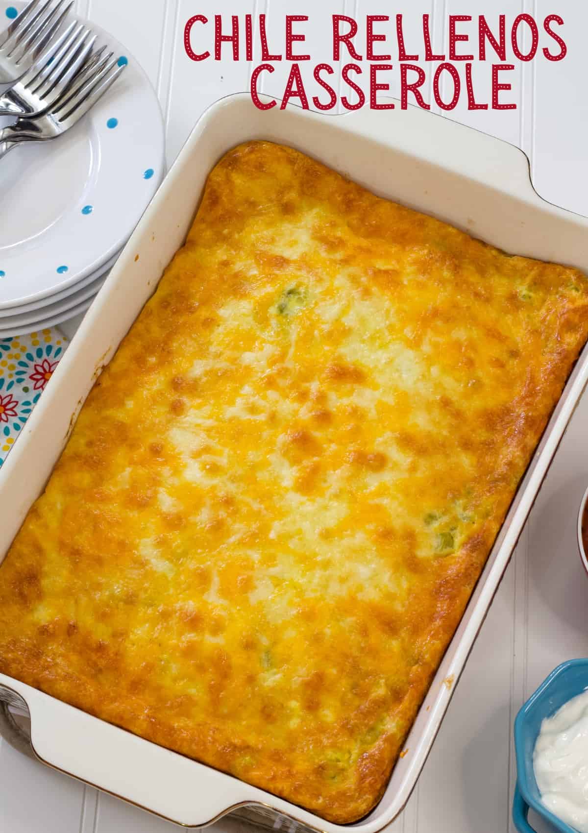 The whole casserole in a 13 by 9 baking dish with recipe title above it so the image can be pinned on pinterest.