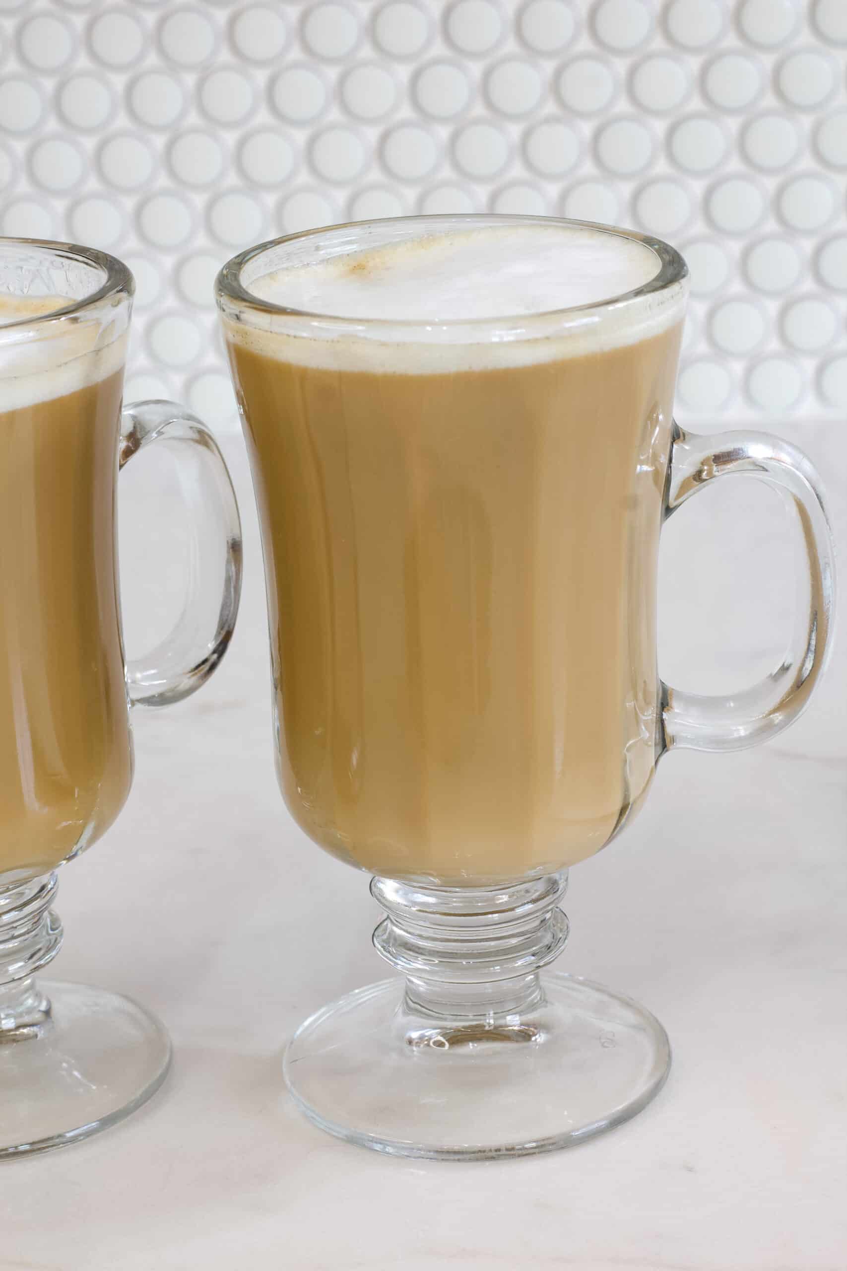 One cup of maple syrup coffee topped with frothy milk.