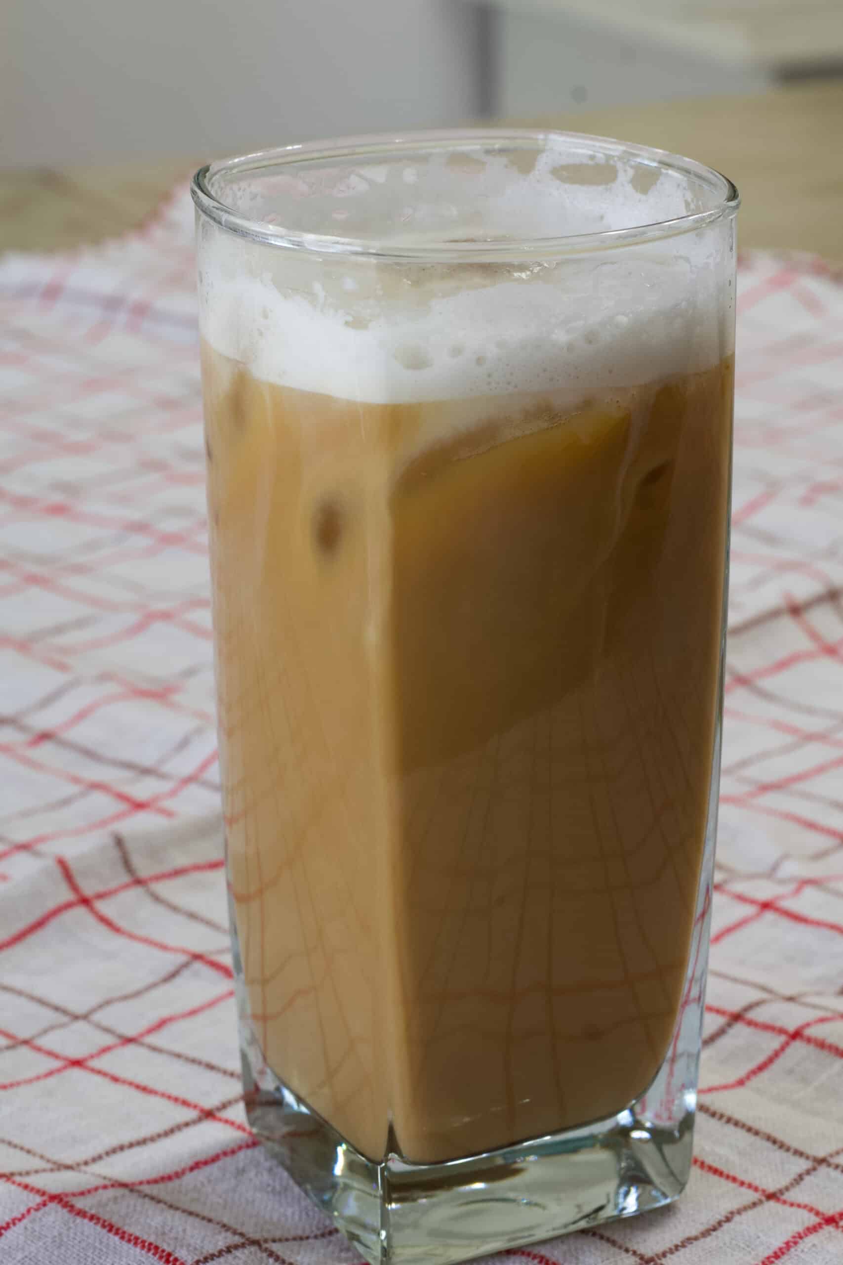 Close up of one glass of maple syrup coffee that has been completely mixed.