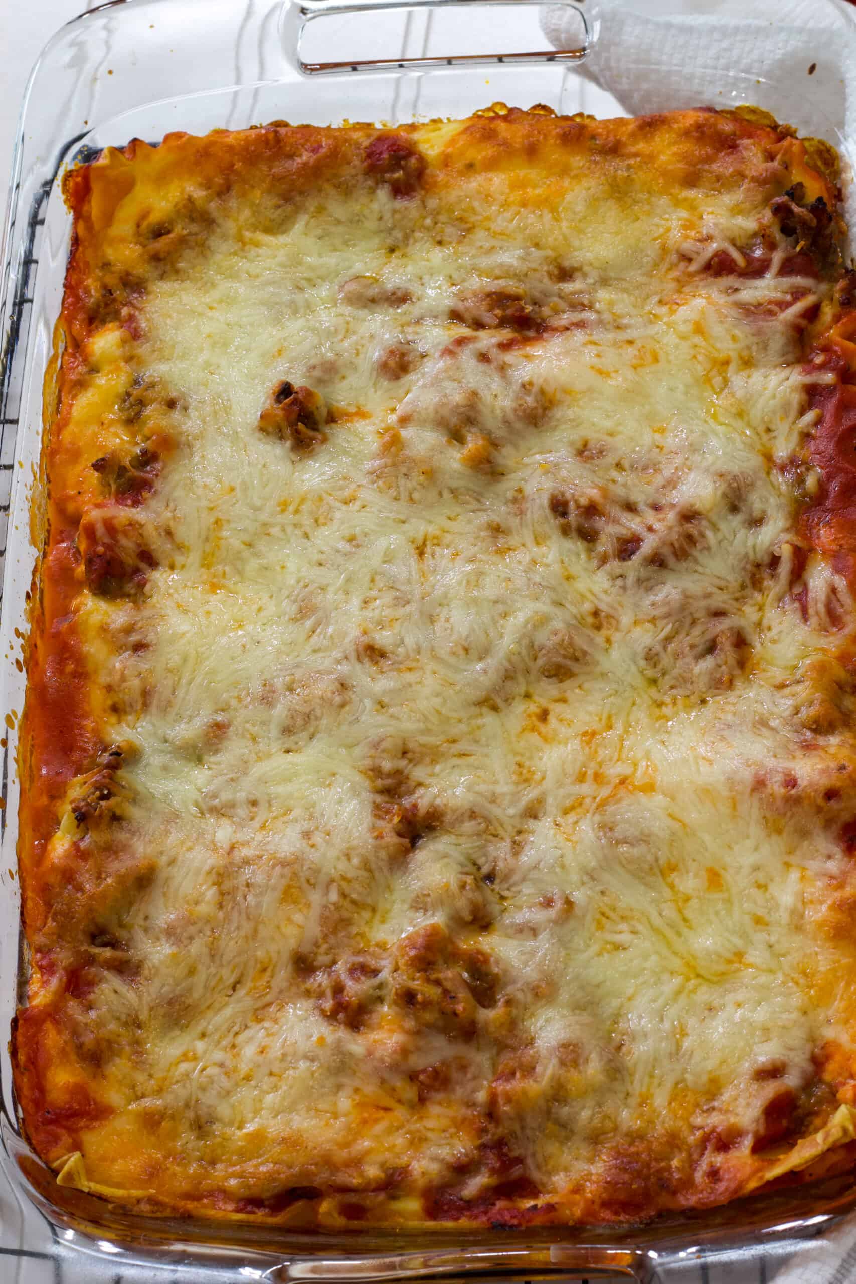 Vertical shot of the entire uncut casserole dish full of classico lasagna.