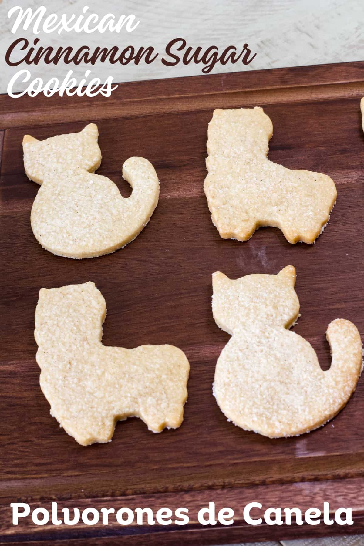 Two cat and two llama cookies on a wooden tray with the title of the recipe in text above and below the cookies so the image can be pinned on Pinterest.