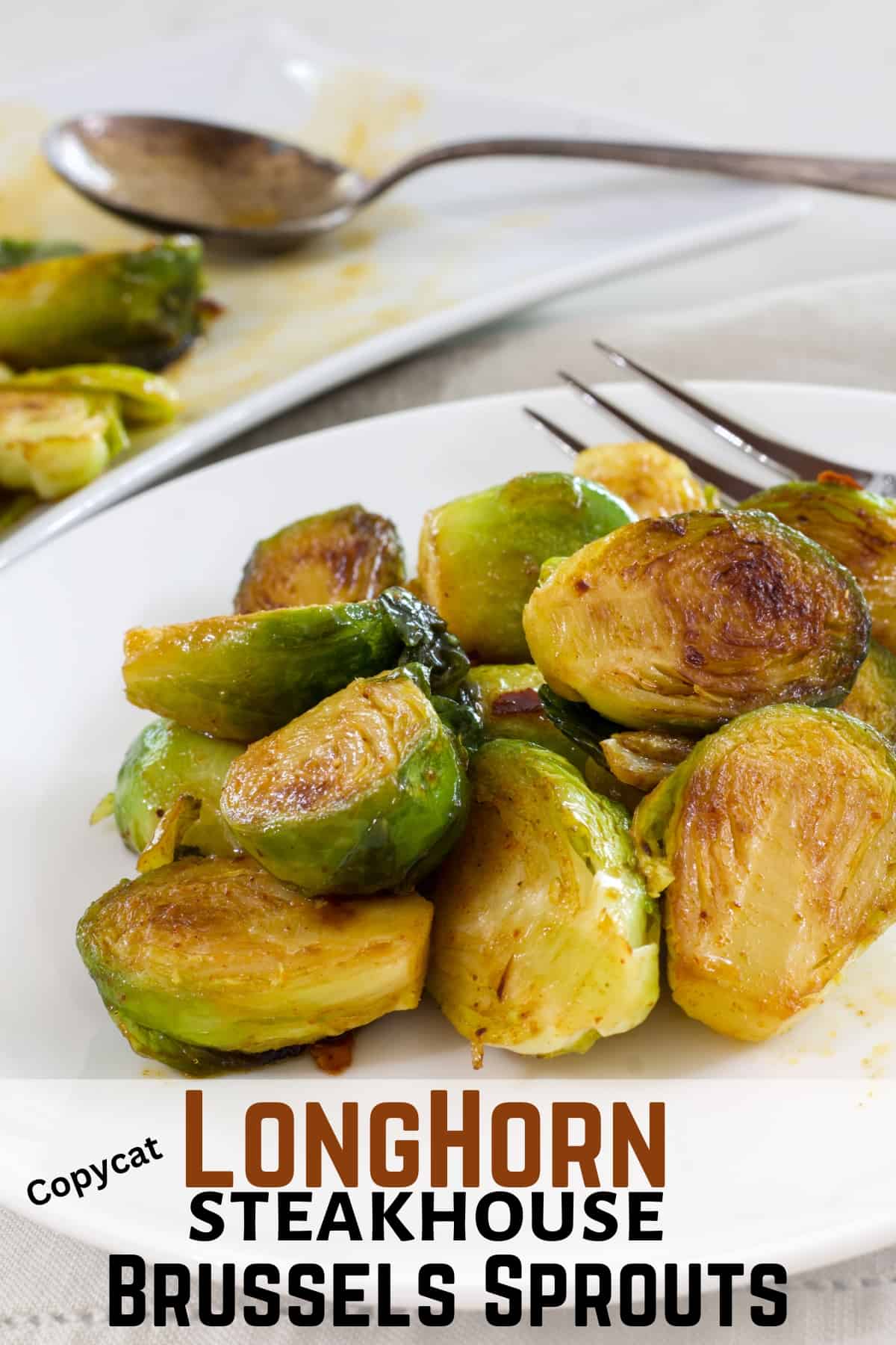A serving of Brussels sprouts on a white plate with the recipe title below it so it can be pinned on Pinterest.