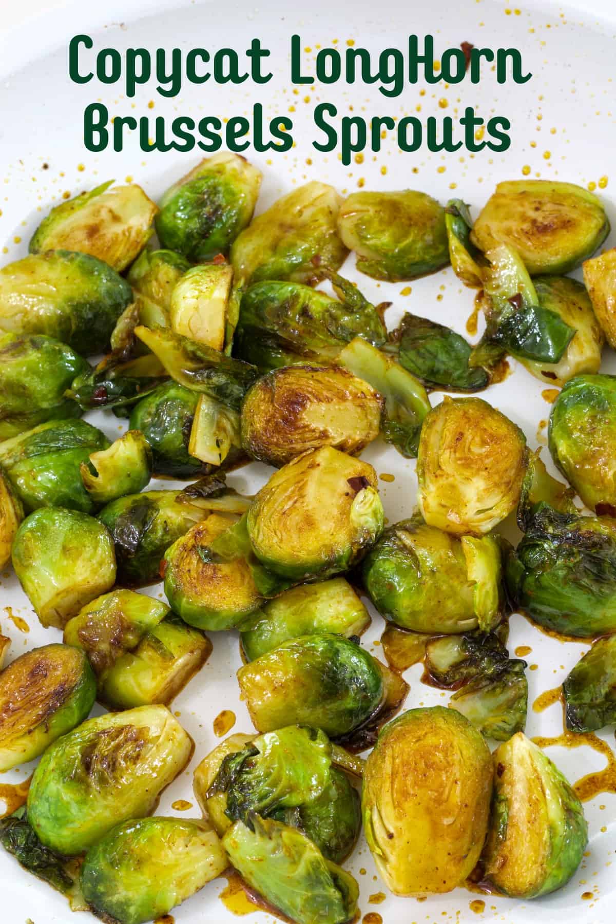 The brussels sprouts in the skillet with the sauce added and the recipe title is above the image so it can be pinned on Pinterest.