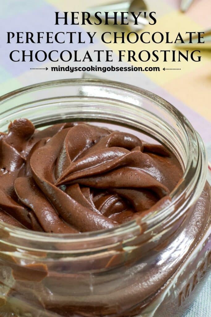 A small mason jar full of Easy Hershey's Perfectly Chocolate Frosting Recipe.