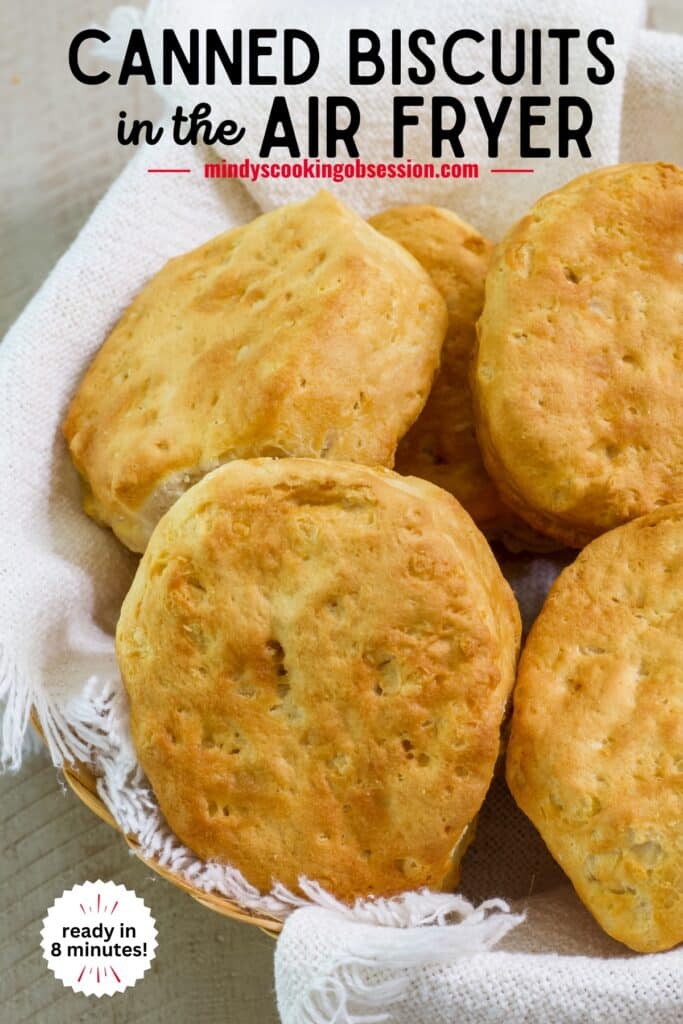 Close up of air fried Canned Pillsbury Grands Biscuits in cloth lined basket with the recipe title at the top so it can be pinned on Pinterest.