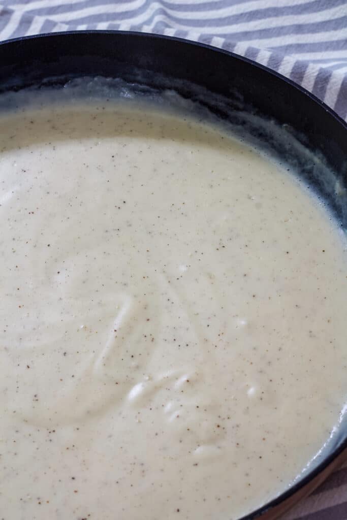 Half of a skillet of Easy Homemade Southern White Country Gravy is visible in this shot.